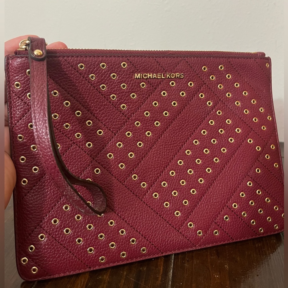 Michael Kors Mulberry and Gold clutch